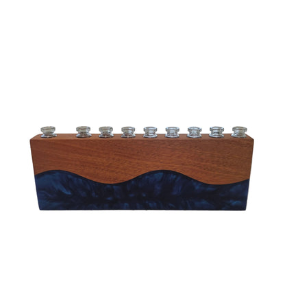 Personalized Hanukkah menorah in narra wood and blue resin with engraved family name and nine glass candle holders