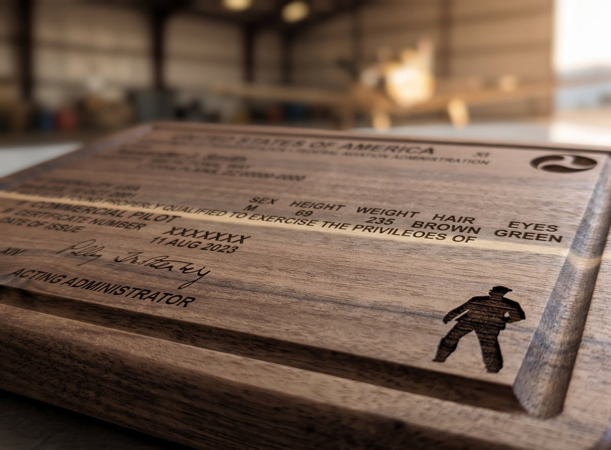 Custom engraved pilot license serving board made of acacia wood, featuring detailed engraving and a smooth finish.