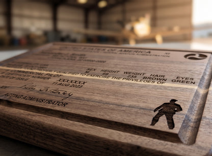Custom engraved pilot license serving board made of acacia wood, featuring detailed engraving and a smooth finish.