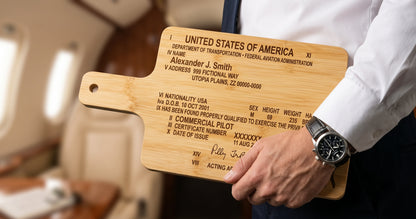 Custom engraved bamboo pilot license serving board with FAA certificate design, ideal for serving and display.