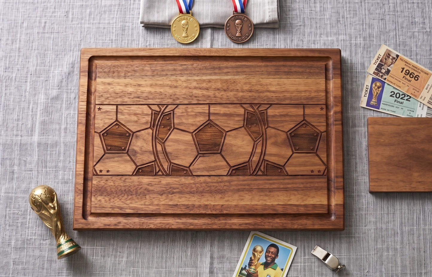 Engraved acacia wood serving board featuring soccer football fan design, perfect for charcuterie and food presentation.