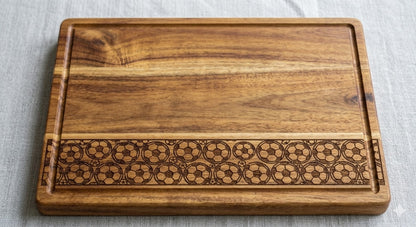 Engraved acacia wood serving board with soccer football fan design, ideal for charcuterie and food presentation.