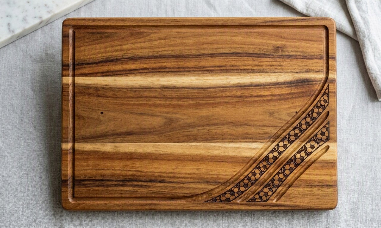 Engraved acacia wood serving board with soccer football fan design, ideal for charcuterie and food presentation.
