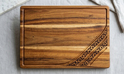 Engraved acacia wood serving board with soccer football fan design, ideal for charcuterie and food presentation.