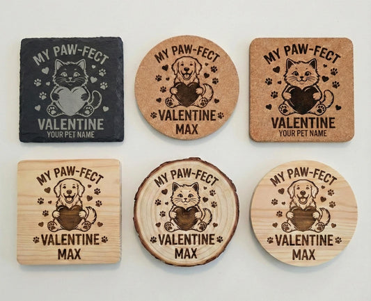 Set of four personalized pet coasters by The Present Spot, engraved with dog or cat names on slate coasters.