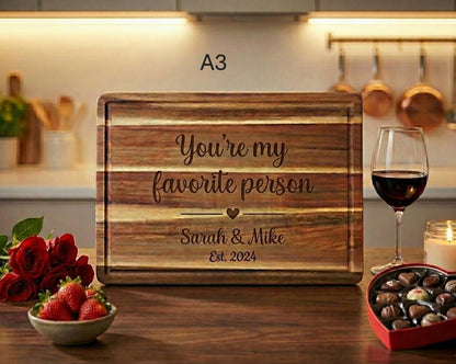 Personalized couple cutting board by The Present Spot, acacia wood, 14x10 inches, ideal for anniversary or Valentine's Day gift.