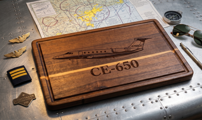 Custom aircraft tail number serving board by The Present Spot, personalized aviator’s cutting board with wood grain and aircraft design.