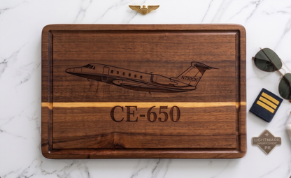 Personalized acacia aircraft tail number cutting board from The Present Spot, ideal for pilots and aviation enthusiasts.