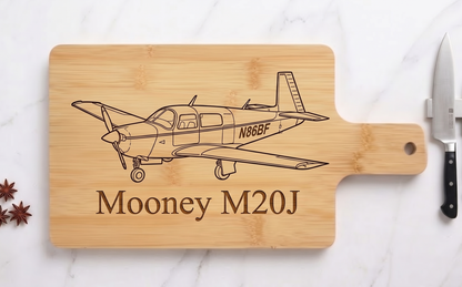 Personalized acacia aircraft tail number serving board from The Present Spot, ideal as a pilot gift or aviator’s cutting board.