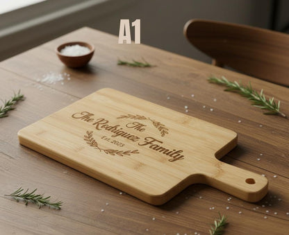 Engraved personalized acacia wood serving board by The Present Spot, perfect for weddings, housewarmings, and cozy kitchen decor.
