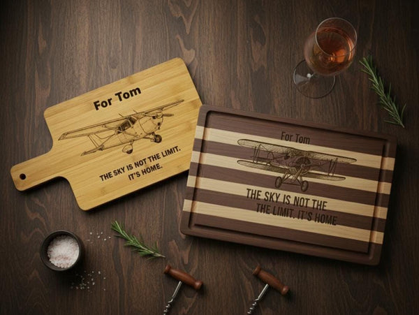 Personalized aviation cutting board with engraved pilot design, made of acacia or bamboo, measuring 14x10 inches.