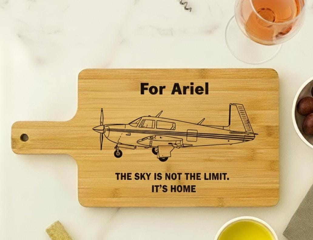 Personalized aviation cutting board by The Present Spot, engraved pilot gift, made of acacia or bamboo, 14x10 inches.