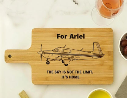 Personalized aviation cutting board by The Present Spot, engraved pilot gift, made of acacia or bamboo, 14x10 inches.