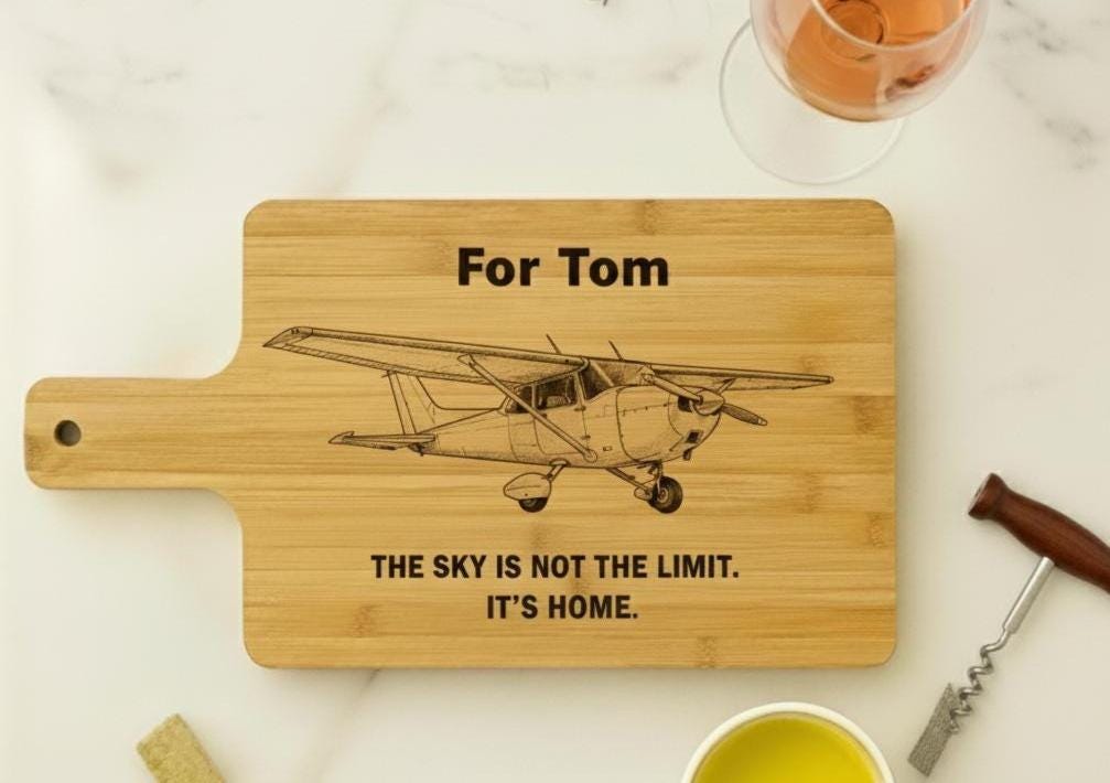 Personalized aviation cutting board with engraved pilot design, made of acacia or bamboo, 14x10 inches, ideal pilot gift.
