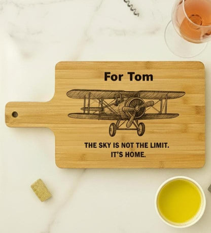 Personalized aviation cutting board made of acacia or bamboo with engraved pilot design, perfect for gift or kitchen use.