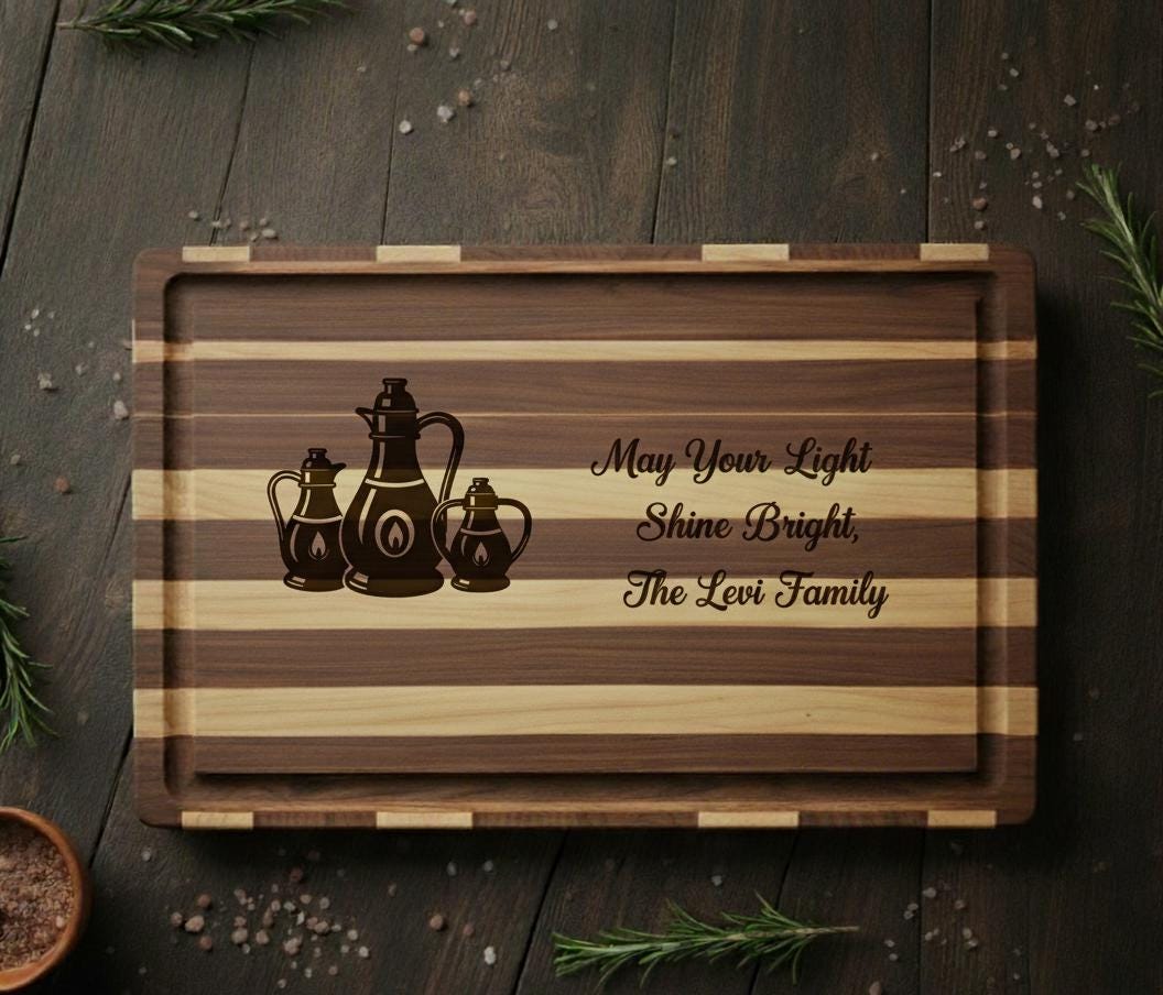 Personalized Hanukkah cutting board by The Present Spot, engraved with oil lamps and family name, made of acacia wood.