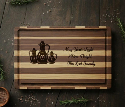 Personalized Hanukkah cutting board by The Present Spot, engraved with oil lamps and family name, made of acacia wood.