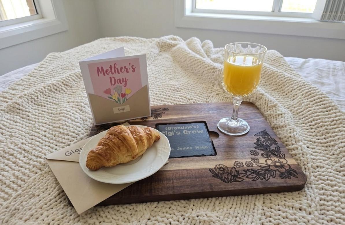 Personalized gift serving board by The Present Spot with a slate inlay, featuring a smooth wooden surface and elegant design.