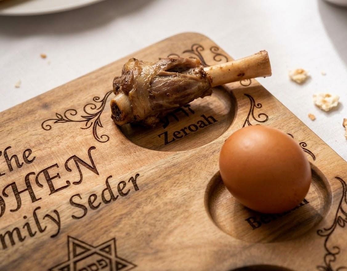 Custom engraved wooden Passover Seder plate cutting board by The Present Spot with personalized family Pesach design.