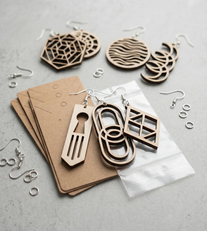 Wood Earring Maker Kit by The Present Spot with 20 blanks, fishhooks, display cards, and bags for jewelry crafting.
