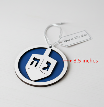Unpainted two-layered Hanukkah dreidel ornament made of laser-cut wood in blue and white, showcasing detailed craftsmanship.